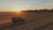 agriculture. retro truck carries a wheat grain harvested across the field at sunset. business agriculture concept. retro