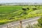 Agriculture scenic view of green fields, river, railroad, bridge