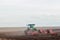 Agriculture,tractor preparing land with seedbed cultivator as part of pre seeding activities in early spring season of