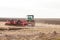 Agriculture,tractor preparing land with seedbed cultivator as part of pre seeding activities in early spring season of