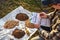 Agriculturist taking notes in soil sampling information sheet at field