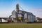 Agro silos granary elevator. Silos on agro-processing manufacturing plant for processing drying cleaning and storage of