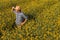 Agronomist in blooming oilseed rape field, aerial view