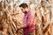 Agronomist checking corn if ready for harvest. Portrait of farmer