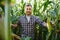 Agronomist checking corn if ready for harvest. Portrait of farmer