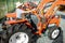 Agronomist choosing tractor at the agricultural shop