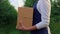 Agronomist hands hold cherries crate. Business farmer carry harvest in orchard.