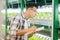 Agronomist making notes of conditions while growing lettuce