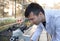 Agronomist working with microscope in greenhouse