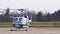 Agusta Bell AB-212 helicopter with spinning rotor preparing for takeoff