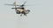 AH-64D Apache Longbow military helicopter attacking targets with canon