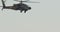 AH-64D Apache Longbow military helicopter attacking targets with canon