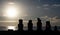 Ahu tahai moai platform at sunset with sun in the background