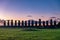 Ahu tongariki moai platform at sunrise with tourists