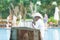 Ahungalla, Sri Lanka - An old native flute player sitting on traditional longboat