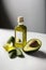 AI generated Avocado oil in a glass bottle with fresh avocados and avocado slices