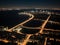 AI generated bird's eye view of a brightly lit city with roads and tall buildings