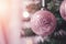 AI generated. Close up of pastel pink Christmas tree toy ball decoration on a fluffy fir branch