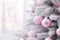 AI generated. Close up of pastel pink Christmas tree toy ball decoration on a fluffy snow-covered fir branch