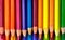 AI generated illustration of an assortment of vibrant colored pencils arranged in a gradient