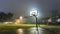AI-generated illustration of a basketball hoop next to a grassy field on a misty evening