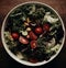 AI generated illustration of a bowl of freshly prepared salad, full of a variety of vegetables