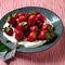 AI-generated illustration of a bowl full of strawberries in whipped cream