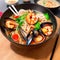 AI generated illustration of a bowl of steaming Asian noodles with mussels and shrimp