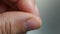 AI generated illustration of A closeup of a person's thumb and index fingers