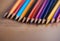 AI generated illustration of  a collection of vibrant colored pencils on a wooden surface