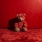 AI generated illustration of a cuddly teddy bear plush toy displayed in front of a vibrant red wall