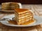 AI generated illustration of a delicious slice of layered caramel cake on a plate with a fork