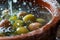 AI generated illustration of olives submerged in brine within a clay pot