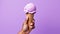 AI generated illustration of a person holding a cone full of ice cream on a purple  background