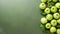 AI-generated illustration of a pile of fresh green apples with leaves against a plain backdrop