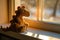 AI generated illustration of a plush stuffed dragon toy on a windowsill