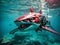 AI generated illustration of a robotic red shark swims in a tranquil underwater environment