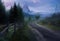 AI generated illustration of A scenic view of a winding road lined by a wooden fence.