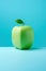 AI generated illustration of a square apple atop a solid blue background