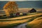 AI generated illustration of a stunning rural landscape with classic barns illuminated by the sunset