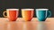 AI generated illustration of three coffee cups in different colors aligned on a table