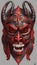 AI generated illustration of a vibrant red demon mask with two horns on a white background