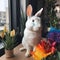 AI-generated illustration of a white rabbit perched atop a countertop adorned with flowers.