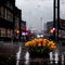 AI-generated illustration of yellow wildflowers growing on the streets during the rain