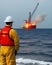 AI generated image of fire incident onboard drilling ship at offshore oil and gas watched by emergency commander