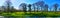 AI generated image of a panoramic photo of a peaceful meadow with trees and stream in autumn