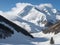 AI generated landscape depicting an avalanche among the snow clad mountains