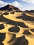 AI generated landscape depicting hot sand desert with a rocky plateau near the horizon