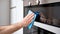 AI generated person diligently cleaning oven