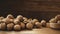 AI generated, photorealistic illustration, pile of wallnuts lying on a wooden table. Mainly brown colors. Vegan food.